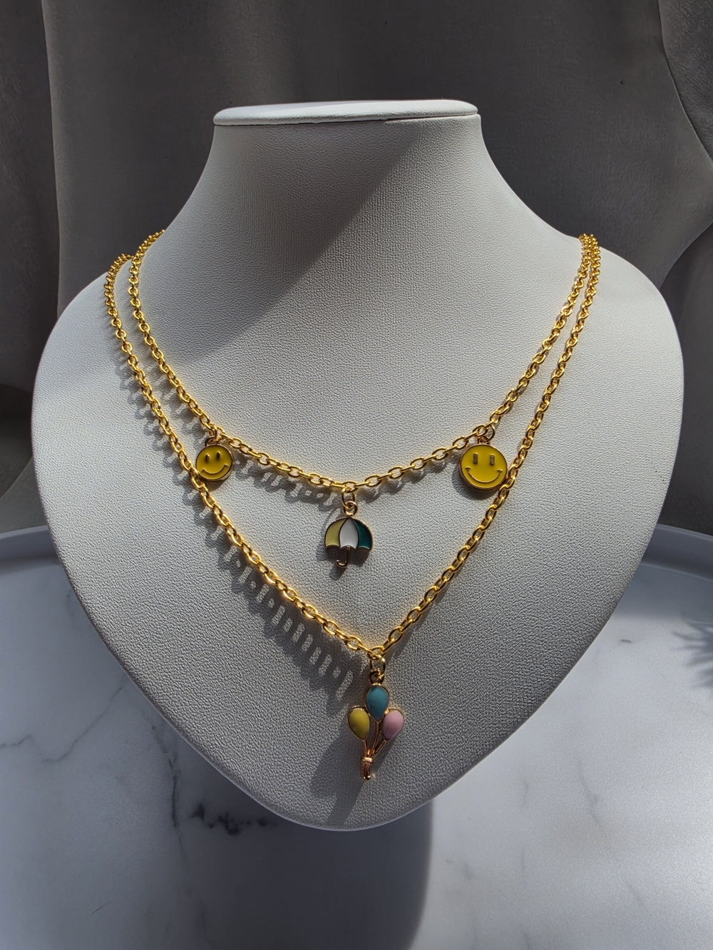 Gold-Tone Layered Necklace with Yellow Smiley & Multicolor Charms
